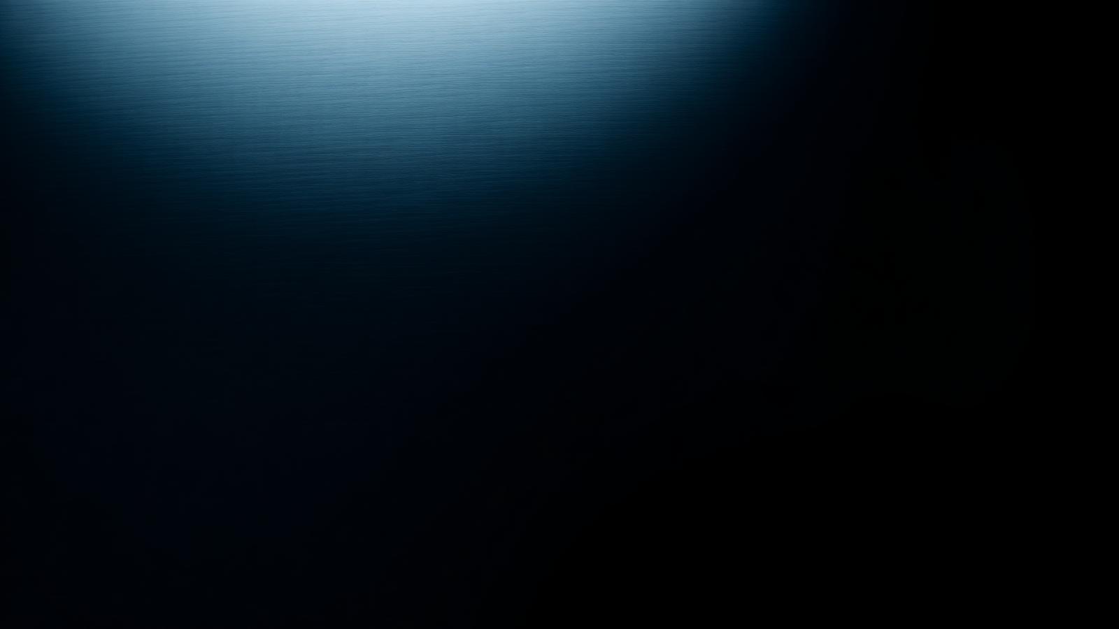 Brushed chrome surface fading into black, representing the BRAYLAND groove aesthetic